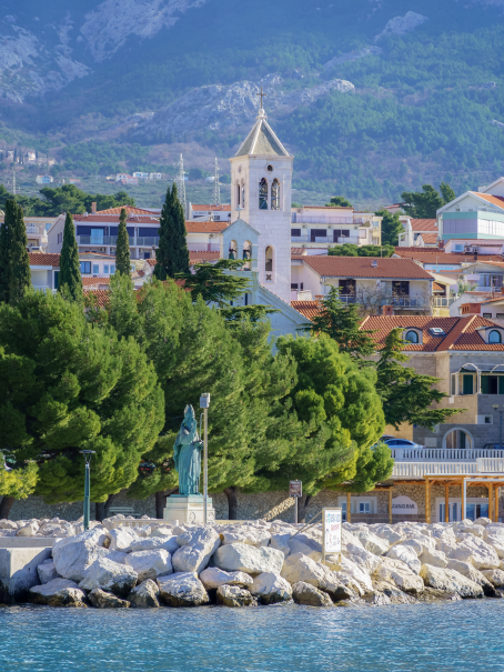 Traditional Dalmatian church in Baška Voda with a stone bell tower