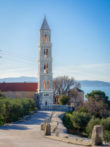 “Stone bell tower above Igrane with the footpath leading up to it