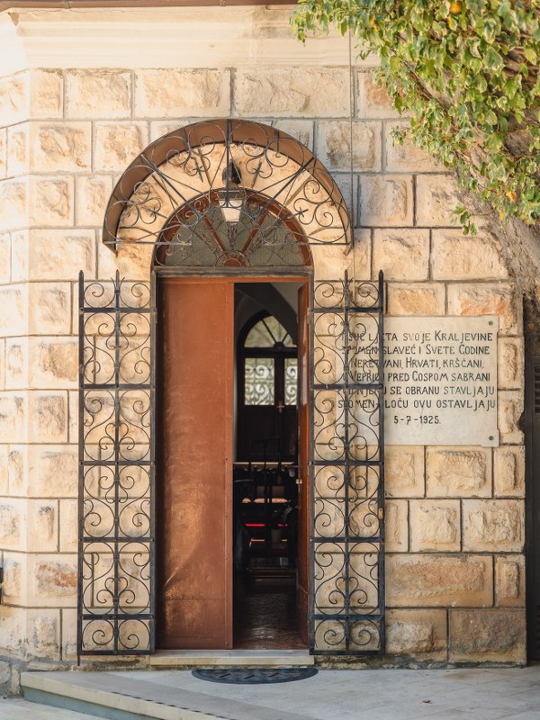 Stone archway entrance with wrought iron gate at the Vepric shrine